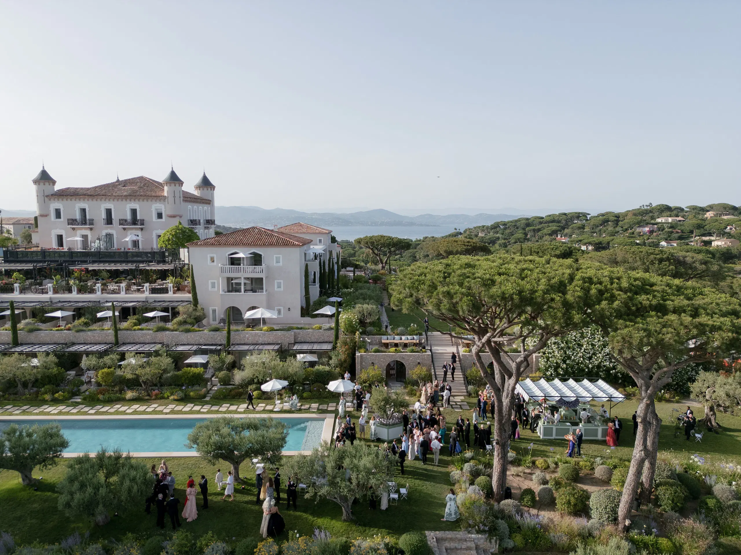 Guests gathering for an Easton Events wedding at Château de La Messardière overlooking the French Riviera in St. Tropez.