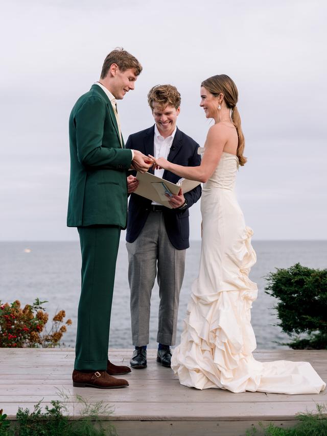 Bride and groom exchanging rings during an oceanfront Easton Events wedding ceremony in Maine.